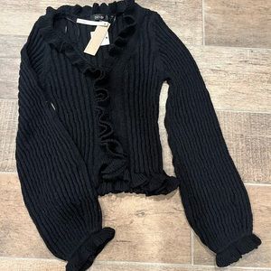 Black sweater with ruffles